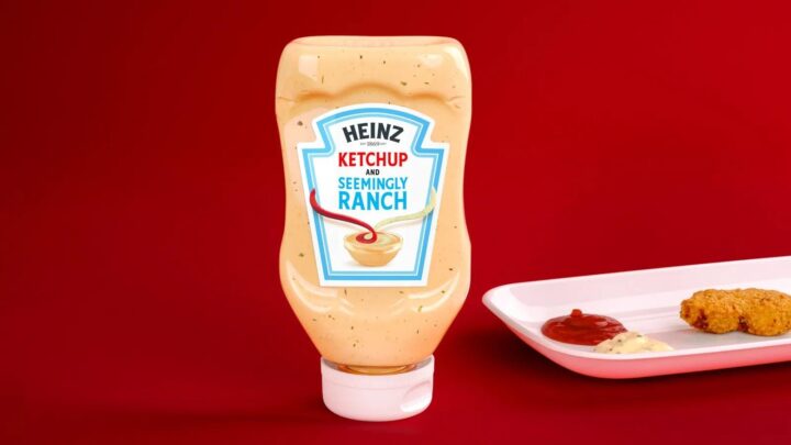 Heinz ketchup bottle next to a tray of fried chicken. Bottle label reads "Ketchup and seemingly ranch"