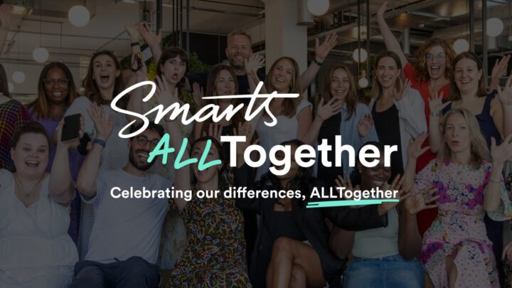 Group of people, some sitting, some standing. Text over the image reads "Smarts AllTogether. Celebrating our differences all together."