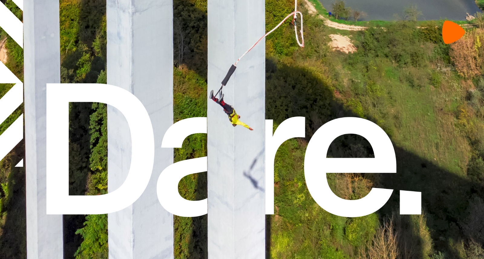 Person bungee jumping off a bridge and the word "Dare." written over image.